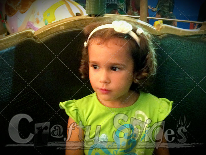 Kira having fun on the tea cups Kira having on one of the rides.