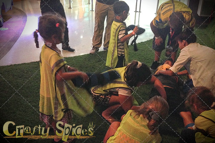 Children helping an injured person (make believe)