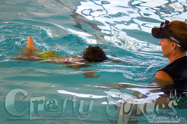 Baby Girl Floating in the pool